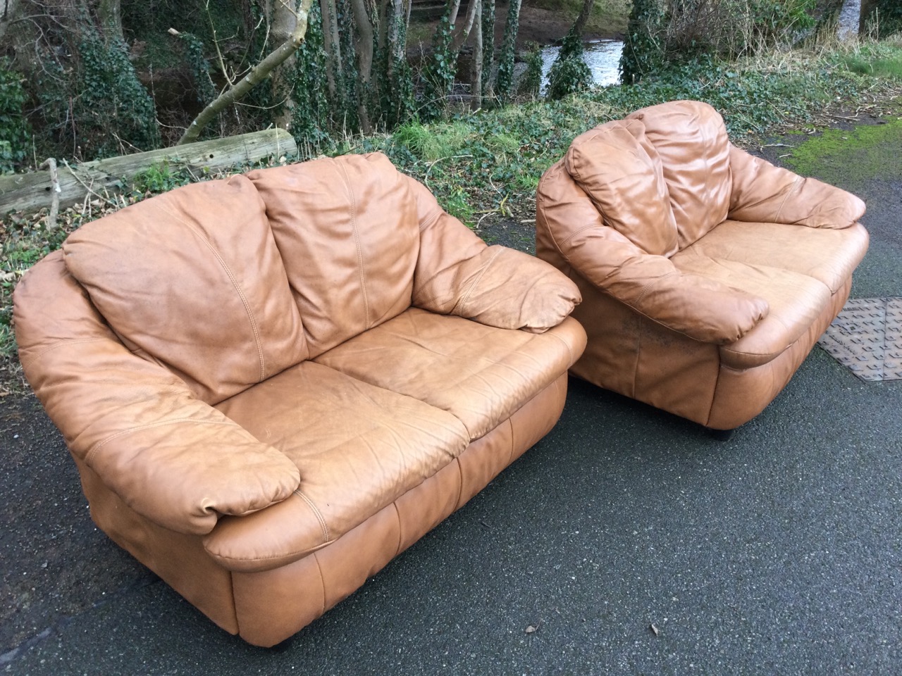 A pair of two-seater leather sofas with integral back, seat and armrest cushions, raised on - Image 3 of 3