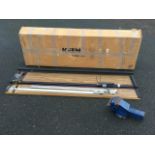 A boxed Kleencut 4ft 6in tabletop paper guillotine; and a cast iron bench vice by Paramo. (2)