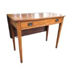 A nineteenth century mahogany serving/dining table, the rectangular top with drop-leaf having