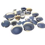 Twenty three pieces of enamelled tinware - bowls, a jug, potties, rectangular surgical trays,