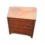 A nineteenth century mahogany bureau with inlaid ebony decoration, the fallfront enclosing an