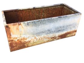 A rectangular galvanised trough with tubular rim. (39.75in x 17.25in x 16in)