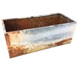 A rectangular galvanised trough with tubular rim. (39.75in x 17.25in x 16in)