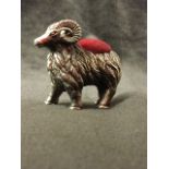 A sterling silver pin cushion modelled as a ram with scrolled horns, having soft mound to back -