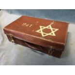 A Second World War suitcase painted with Star of David insignia, containing a quantity of German