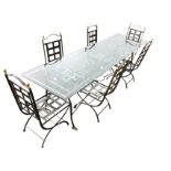 A contemporary Italian dining table & chair set after Diego Giacometti, the rectangular glass top on
