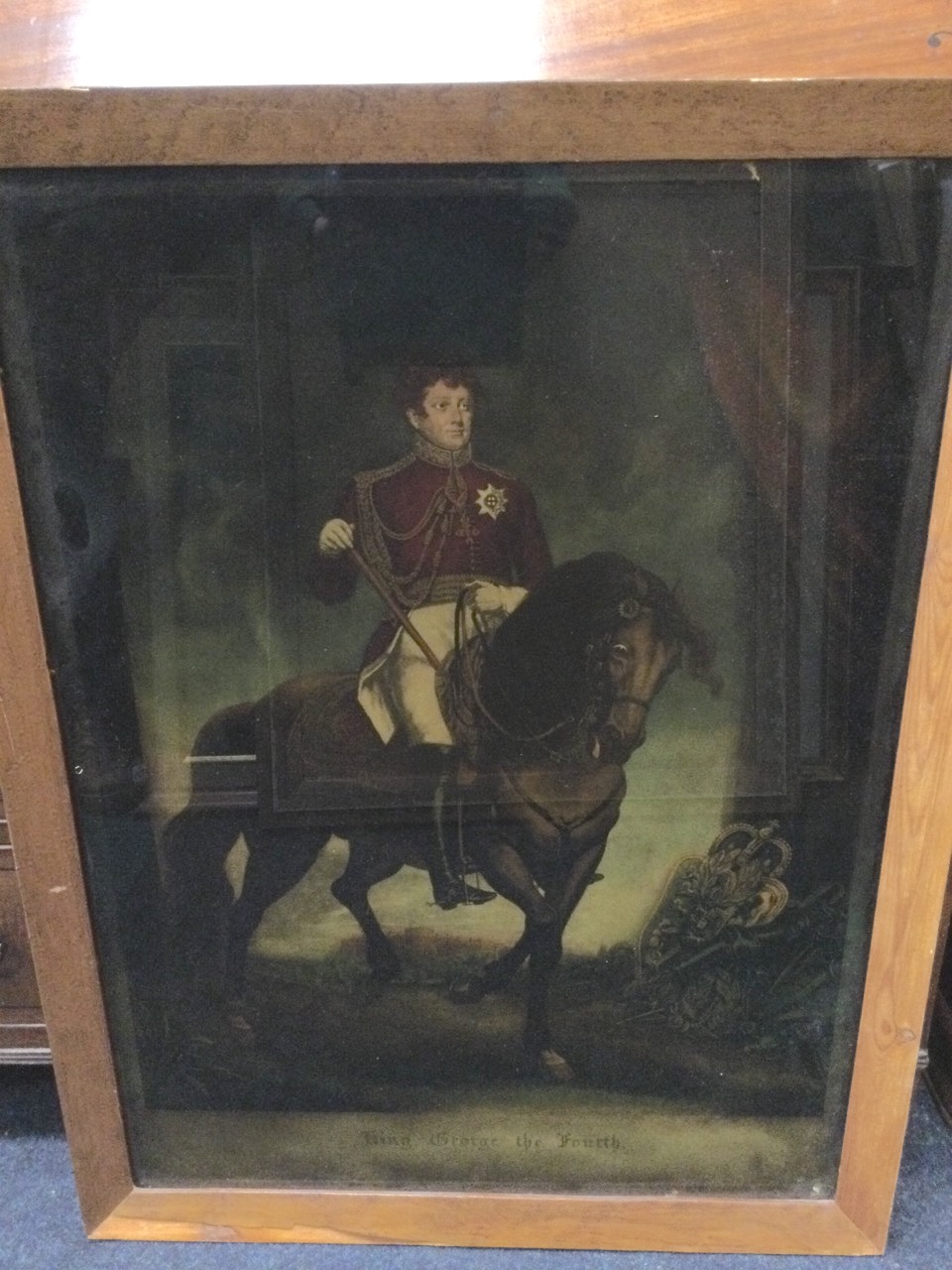 A reverse glass image of George IV, the mounted monarch in draped staged setting with Windsor Castle