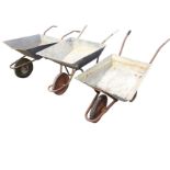 Three galvanised wheel barrows. (3)