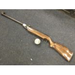 A Spanish Cometa 200 .22 air rifle with beech stock; together with a tin of magnum .22 hunting
