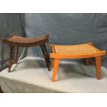 A Victorian carved oak stool with dished stud upholstered seat in floral carved rails raised on