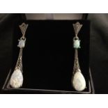 A pair of boxed silver, opal and marcasite drop earrings, the studs with tapering arrowhead panels