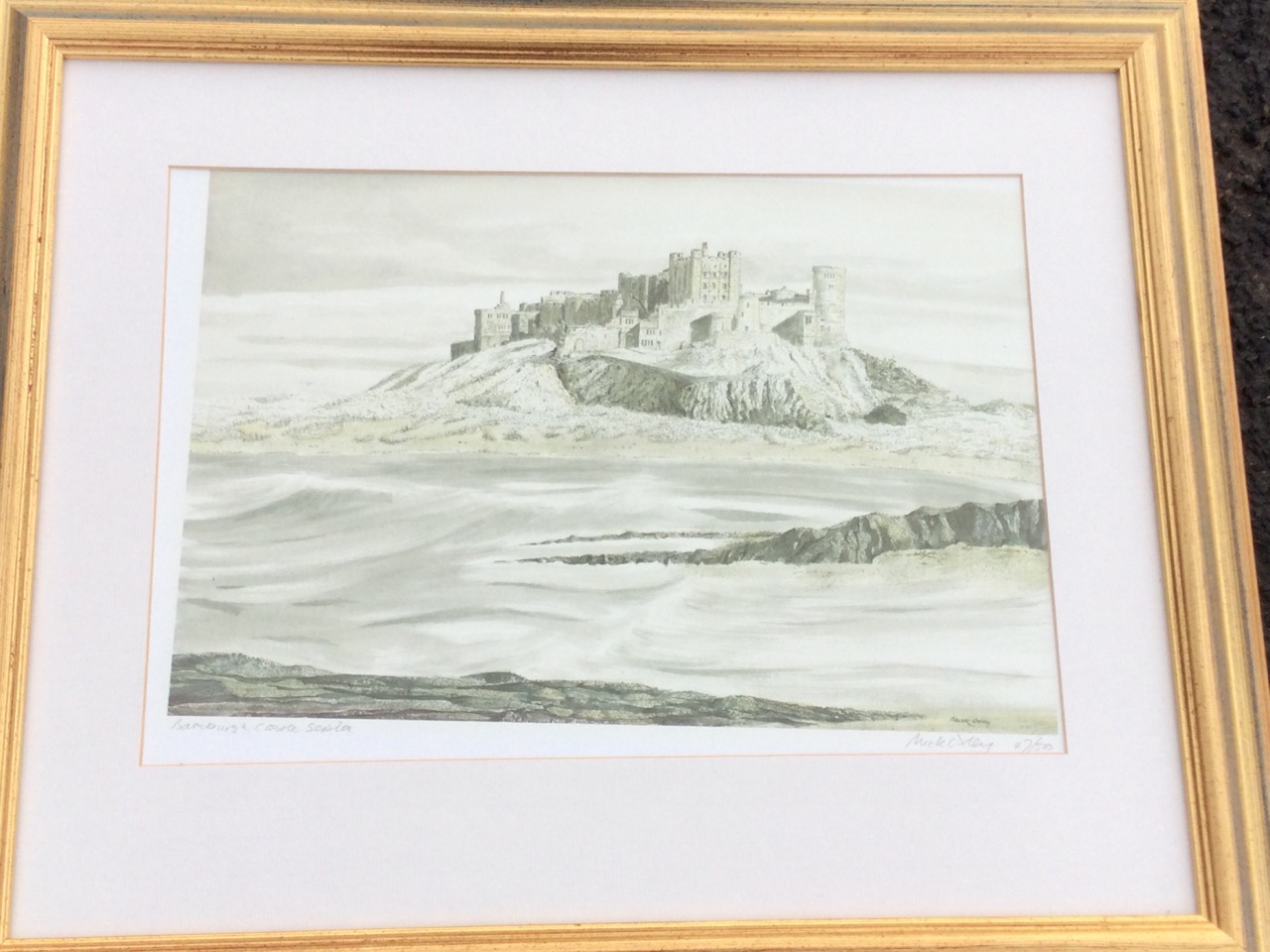 Mick Oxley, a sepia print of Bamburgh Castle, signed in pencil on margin and numbered, mounted & - Image 2 of 3