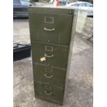 A four-drawer filing cabinet with unusual locking brass patent handles and label holders, complete
