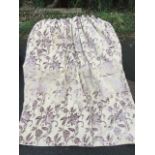 A pair of Laura Ashley thermal lined curtains, the mauve floral printed flock pattern on fawn