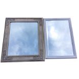 A rectangular reproduction mirror in channelled silvered frame having applied scrolled decoration to