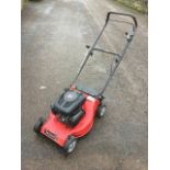 A Champion 40 rotary garden scarifier mower with petrol engine.