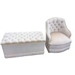 A contemporary rectangular button upholstered ottoman bench with hinged lid and pleated apron to