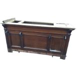 A Victorian mahogany shop counter, the panelled cabinet lacking top, having drawers behind mounted