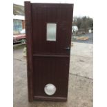 A stable type tongue & groove external door, hinging in two halves with window apertures, complete