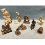 Nine brass and resin faux bronze sculptures - birds, a unicorn, a kilted Scotsman, a dragon group, a