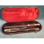 A cased Victorian carving set by Rodgers - Cutlers to Her Majesty, with horn handles and