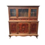 A French oak and burr walnut buffet, the top with moulded cornice above three glazed doors with