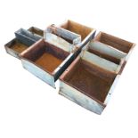 A pair of rectangular galvanised troughs with flat rims, fitted with central compartments for