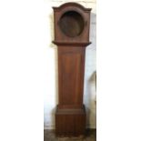 A Victorian oak longcase clock case with moulded arched hood above a circular aperture for a drum