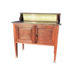 A late Victorian mahogany washstand with tiled back above a marble slab, having two fielded panelled