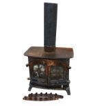 A cast iron stove with top flupipe above a rectangular rounded platform and two arched glazed