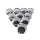 A set of ten new plastic tapering garden flower pots of traditional shape in a mottled silvered