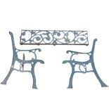 A dismantled cast iron garden bench, the rectangular pierced back panel cast with scrolled flowers