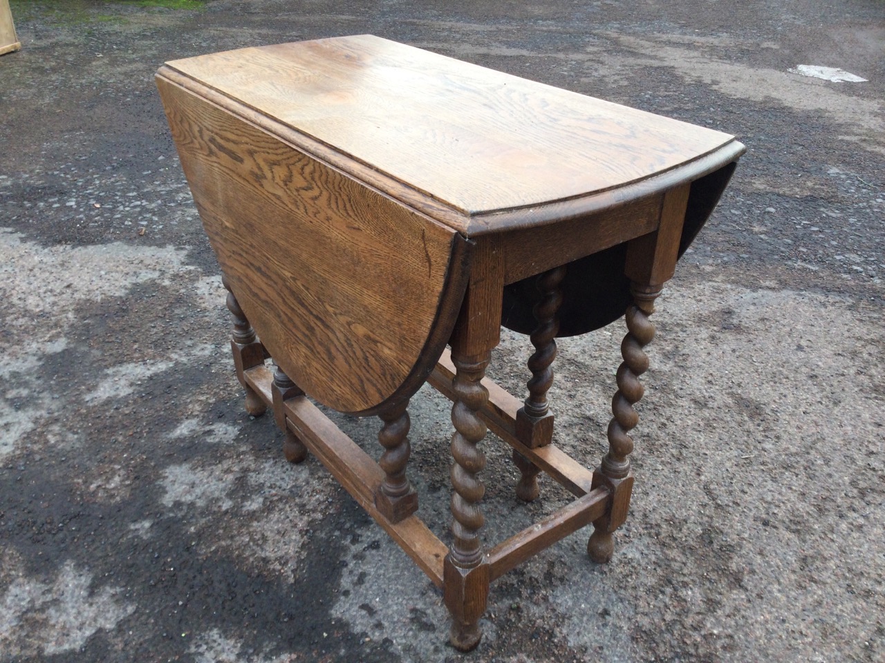 An oval oak gateleg table, the moulded top on barleytwist legs joined by rectangular stretchers, - Image 2 of 3