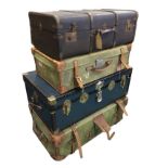 A khaki canvas covered trunk and suitcase with leather mounts, handles and straps, the trunk with