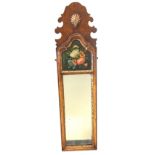 A Georgian style walnut framed mirror with shaped fretwork crest mounted with gilt shell, the