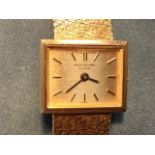 An 18ct yellow gold ladies Patek Phillipe wristwatch, the rectangular bezeled dial with baton hour