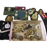 A collection of military badges and buttons including an airforce police warrant badge/wallet, civil