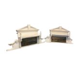 A pair of painted pine overmantels of architectural form, having moulded pediments above shelves,