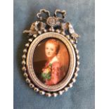 A belle époque style oval miniature of a lady, the waist portrait in silver plated frame with bead