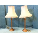 A pair of oak candlestick type tablelamps, possibly by "mousey" Thompson of Kilburn, with twisted