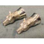 A pair of silver plated horsehead cruets mounted on plain circular collar stands. (2.75in) (2)