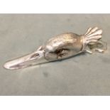 A silver plated stationery clip modelled as a duck head, the sprung hinged bird inlaid with glass