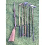 A set of six hickory shafted golf clubs; and the rusty old bits of a schoolboys air rifle. (7)