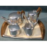 A Picquot Ware four-piece stylish teaset with wood handles to teapot & jug, complete with 60s
