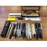 A collection of pens including, Mont Blanc, Burnham, Waterman, Parker, roller balls, mechanical