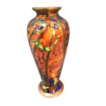 A Wedgwood fairyland lustre tapering vase with waisted neck and circular foot decorated in the