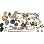 A collection of costume jewellery including paste spray brooches, earrings, bracelets, an