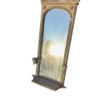 A nineteenth century peer glass with rectangular plate in arched frame having applied gesso bead &