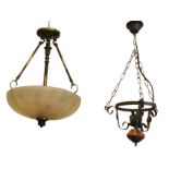 A hanging light with fluted etched glass bowl suspended by brass rods from bun shaped rose, with