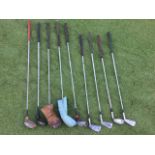 Nine miscellaneous golf clubs - irons and woods. (9)